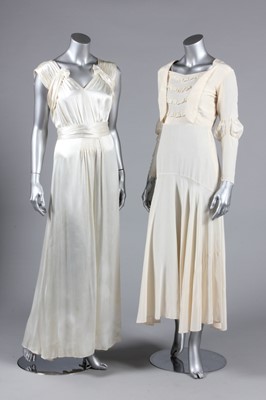 Lot 369 - Three 1930s silk bridal gowns, one with...