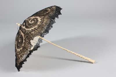 Lot 428 - A good black Chantilly lace parasol with...