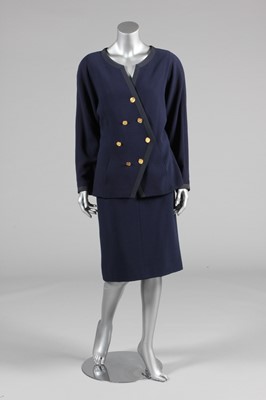 Lot 443 - A Chanel boutique navy wool suit, 1980s,...