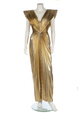 Lot 218 - A Loris Azzaro pleated gold lamé dress, 1980s,...