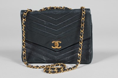 Lot 273 - A Chanel midnight blue leather bag, circa 1980,...