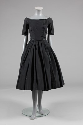 Lot 38 - A Galanos black taffeta and satin edged dinner...